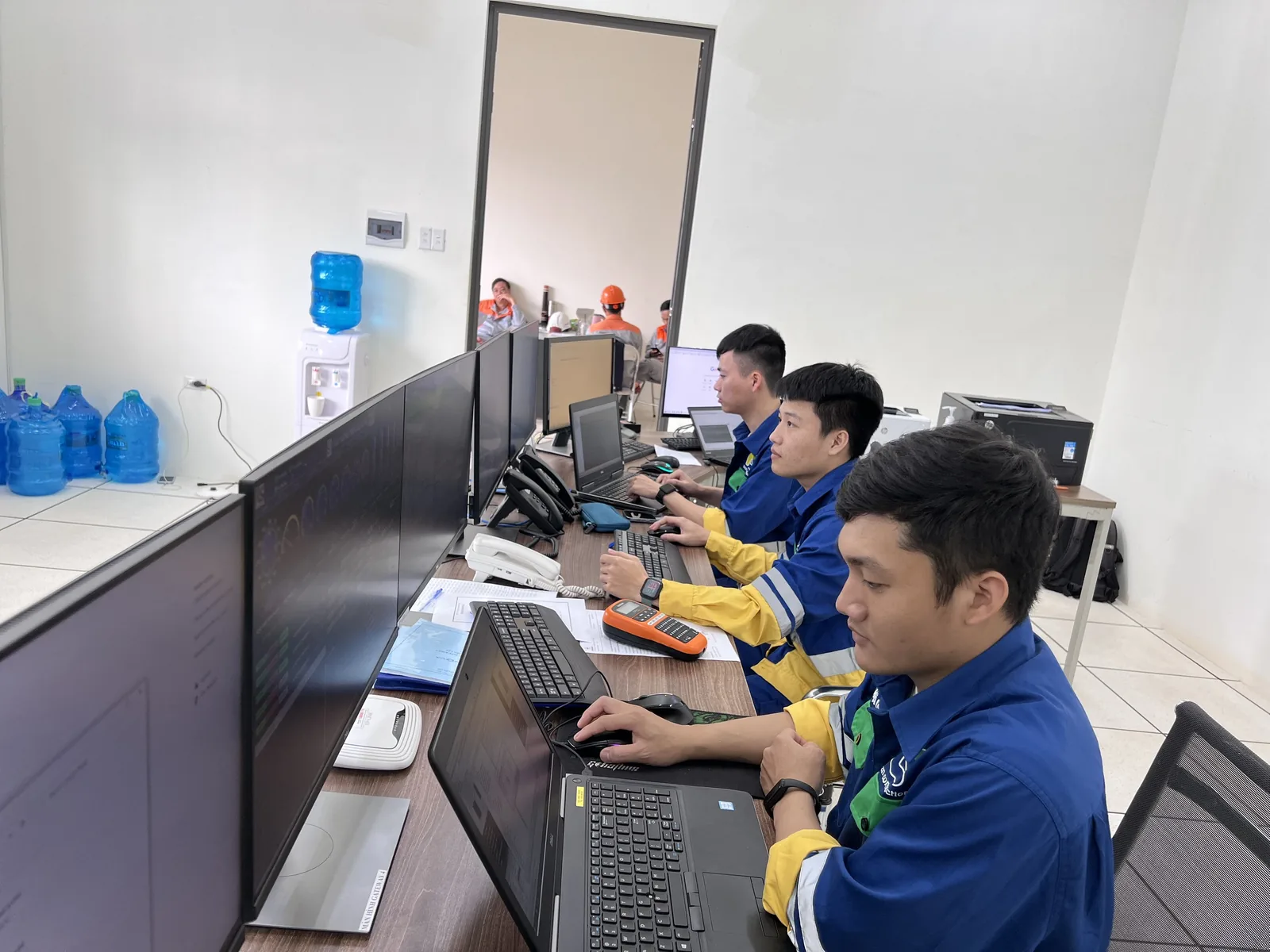 ITS engineers working in a control room